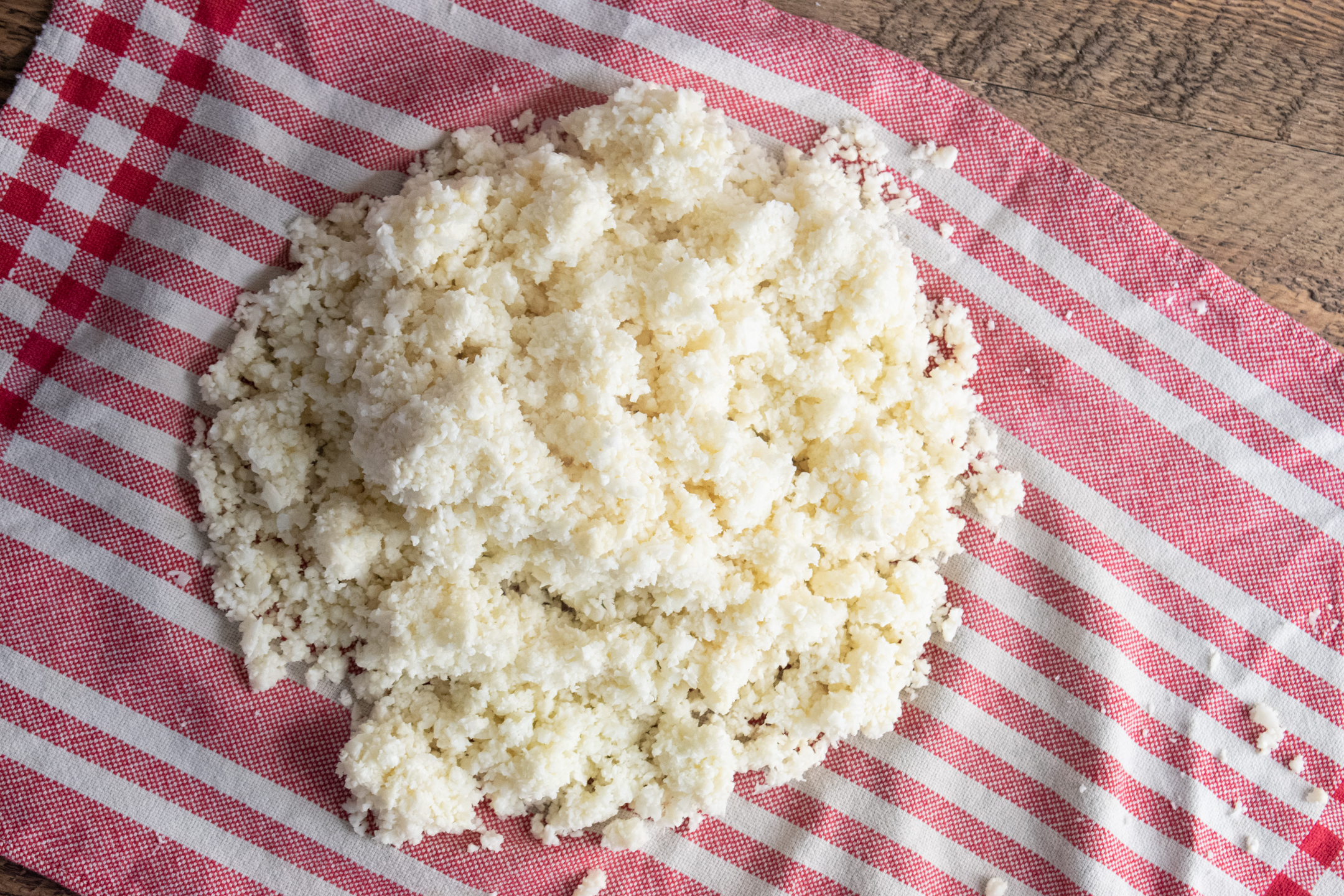 step 1 to make cauliflower egg wraps which is chopping up your cauliflower into cauliflower rice