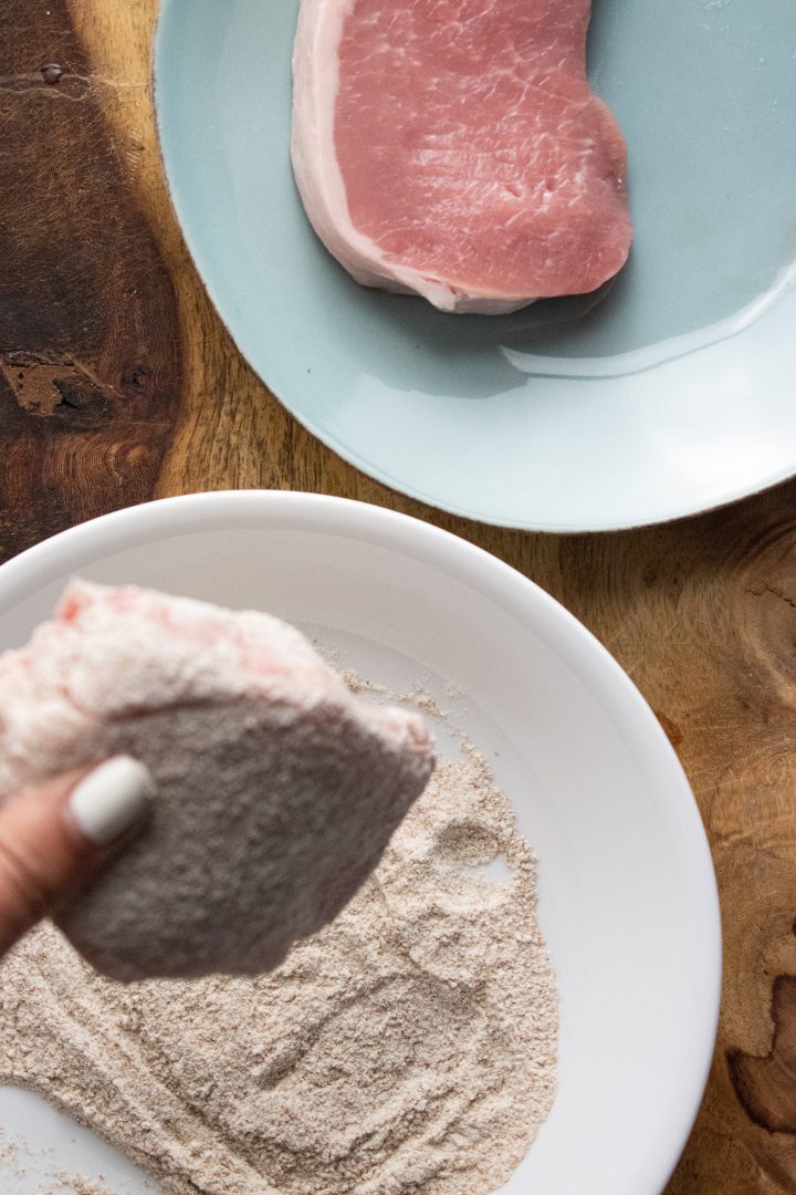 porkchops being dipped into flour