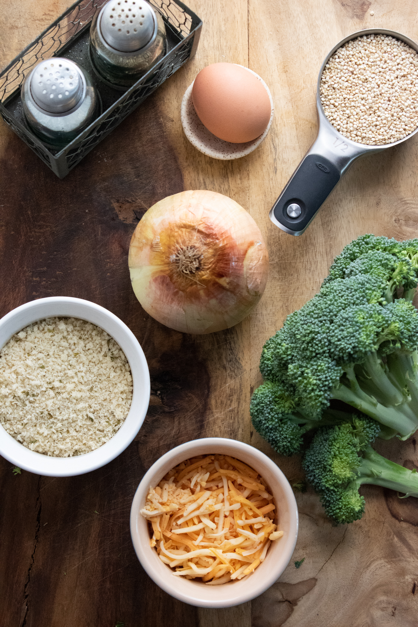 ingredients for quinoa veggie patties on a wooden board