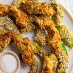 A close up of super crispy avocado fries made in the air fryer.