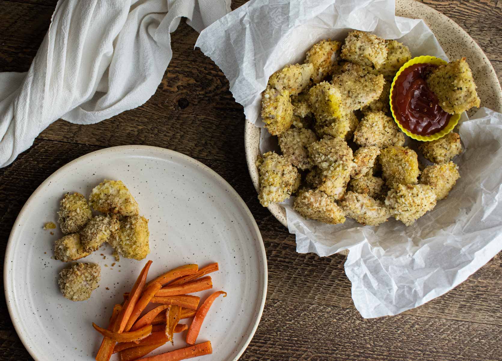 homemade baked chicken nuggets with a side of honey glazed carrots