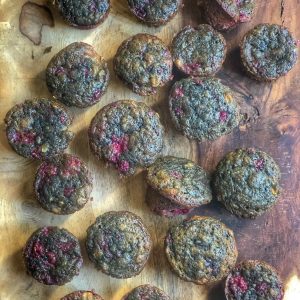 raspberry banana mini muffins on a wooden board