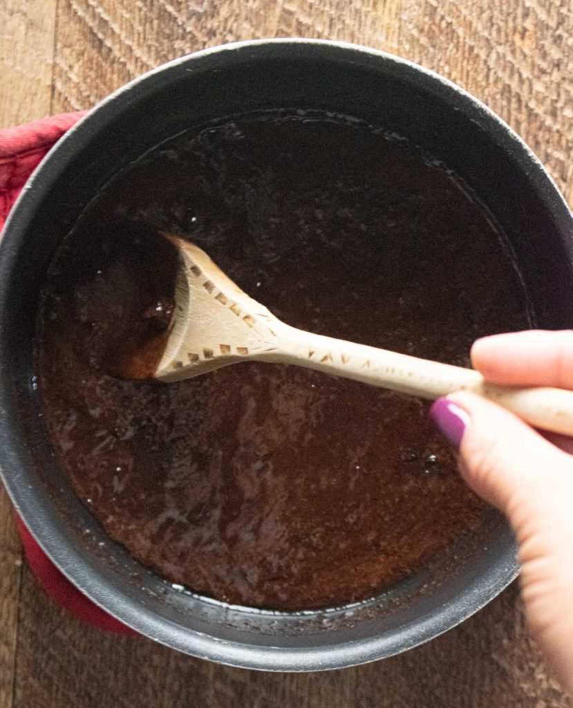 a pot melting chocolate and coconut oil