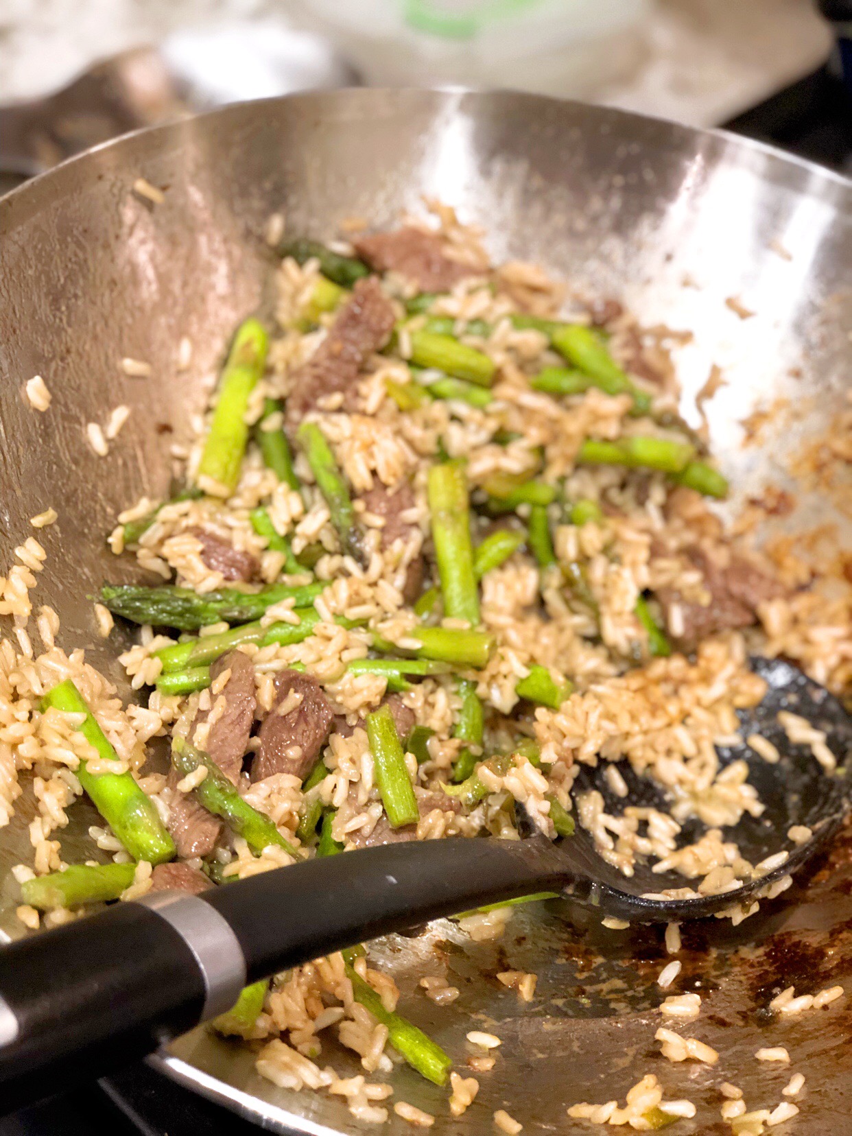 close up of steak stir fry cooking in awok
