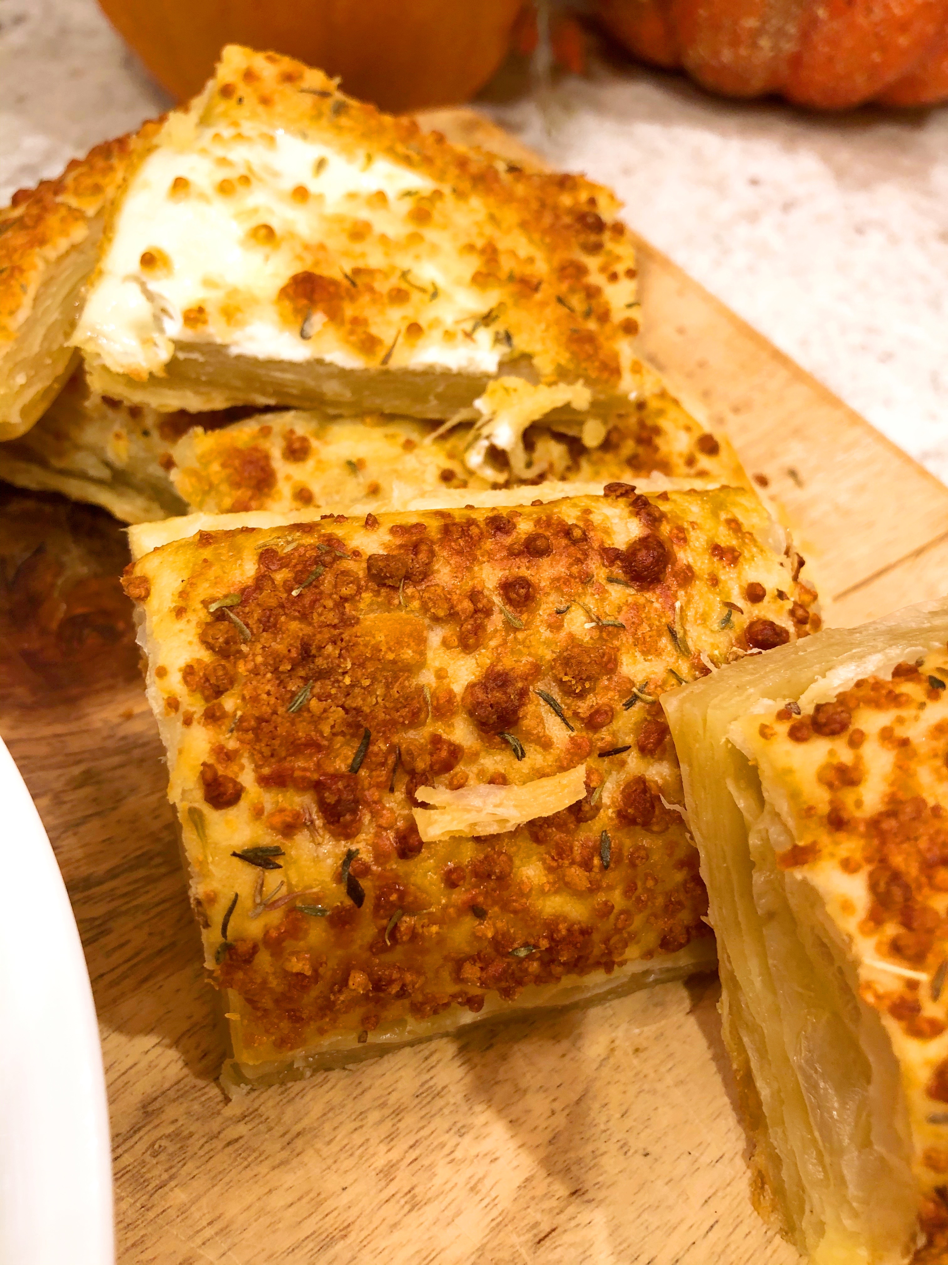 Close up of cheese crisps on a cutting board
