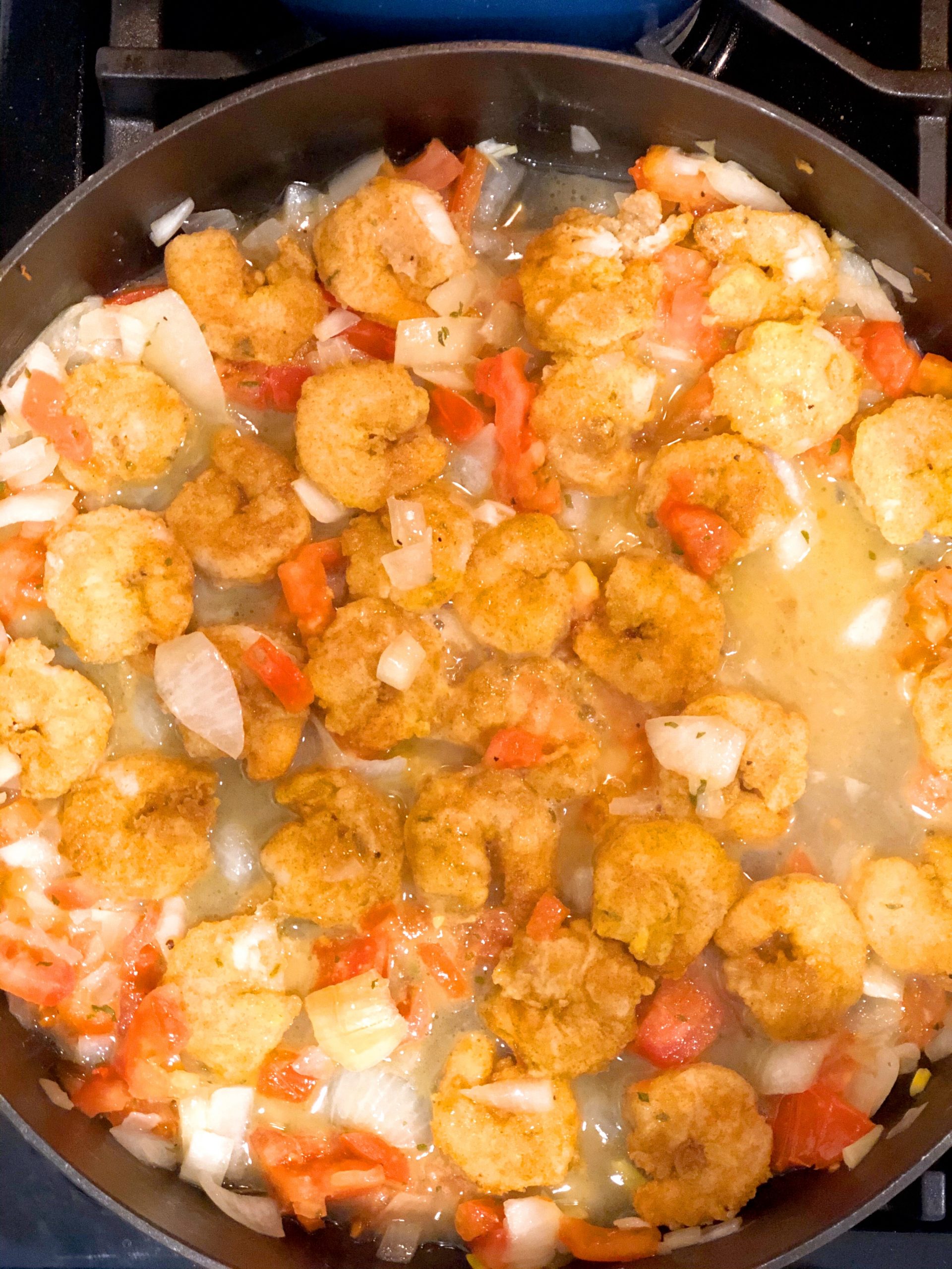 healthy shrimp franchaise in a frying pan simmering