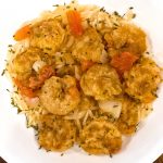 birds eye view of healthy shrimp franchaise over whole wheat pasta