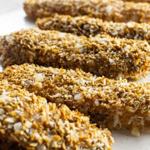 close up of coconut crusted chicken strips made with whole grain cereal