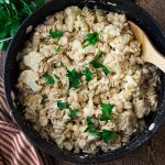 one pot cauliflower mac and cheese in a large pot topped with parsley