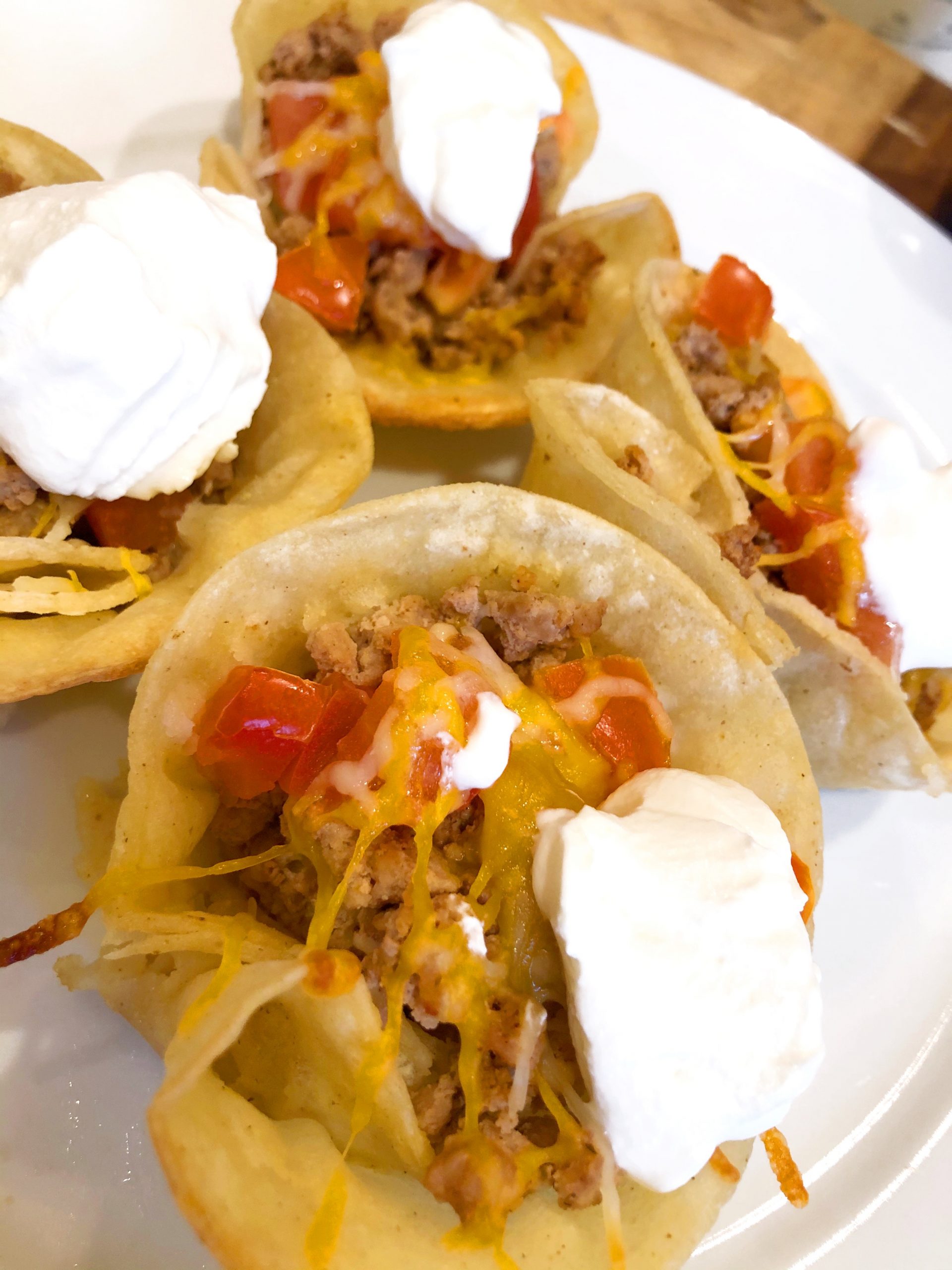 close up of ground turkey taco cupcakes with plain greek yogurt