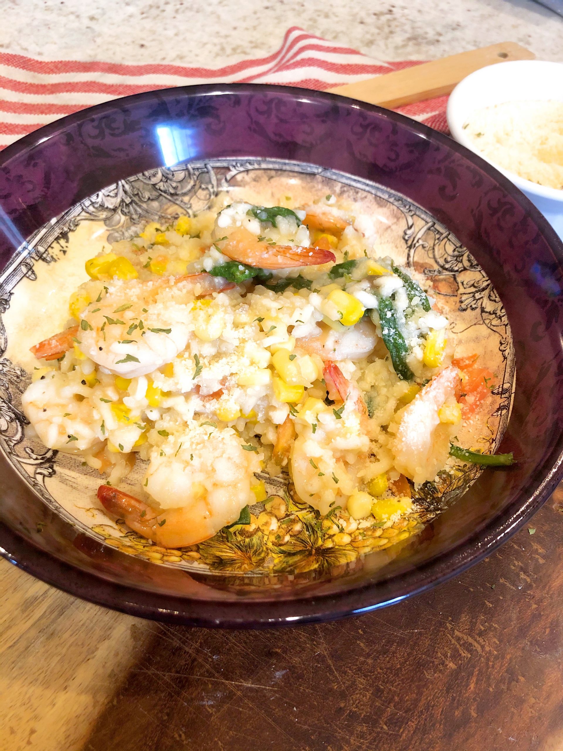 close up of sweet corn risotto and sauteed shrimp