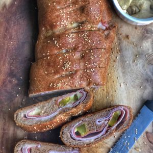 healthy cuban stromboli on a wooden board