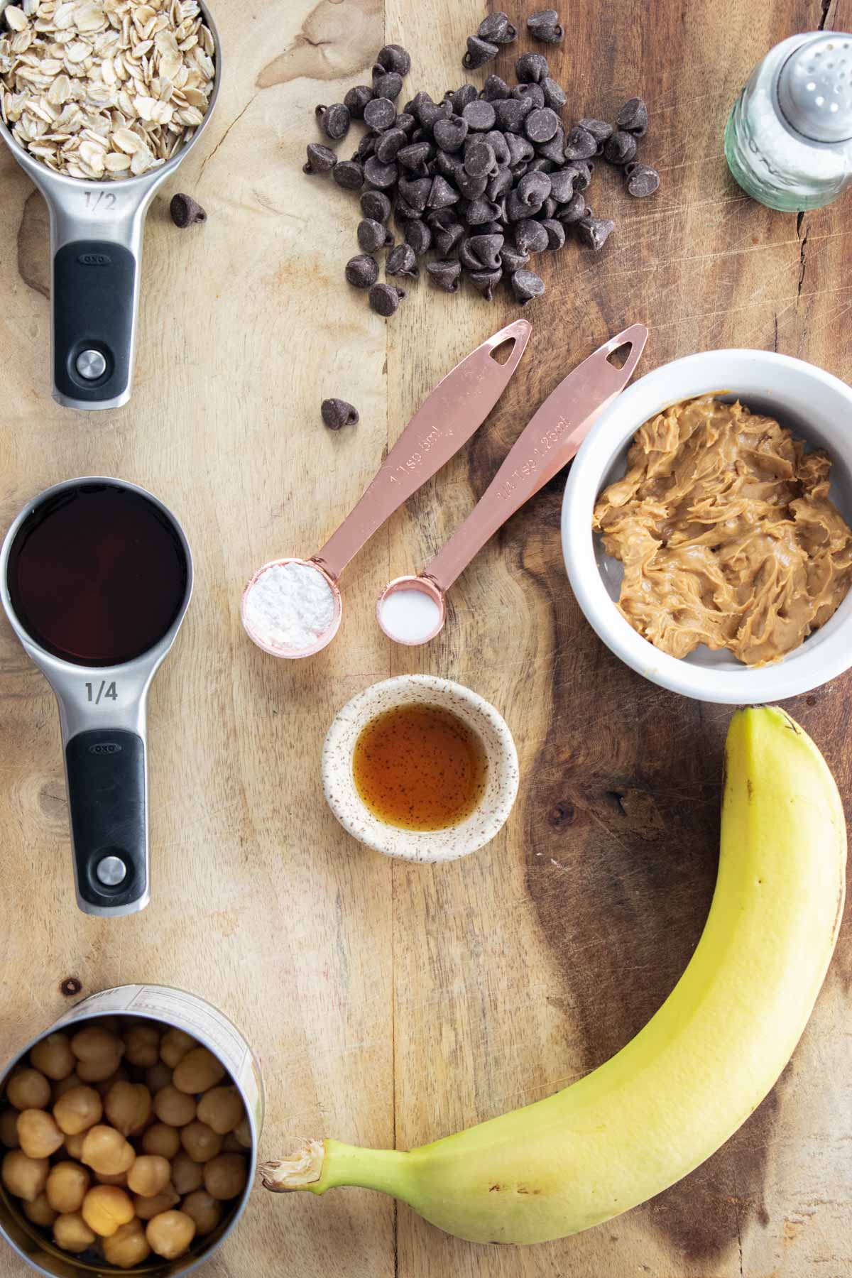 ingredients for flourless banana muffins on a wooden board