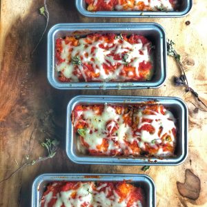 mini chicken parm meatloaves on a wooden board