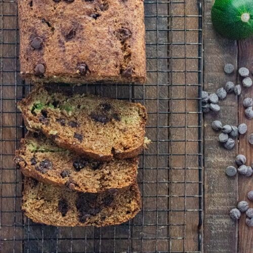 Chocolate chip zucchini bread cut up into slices on a cooling rack.