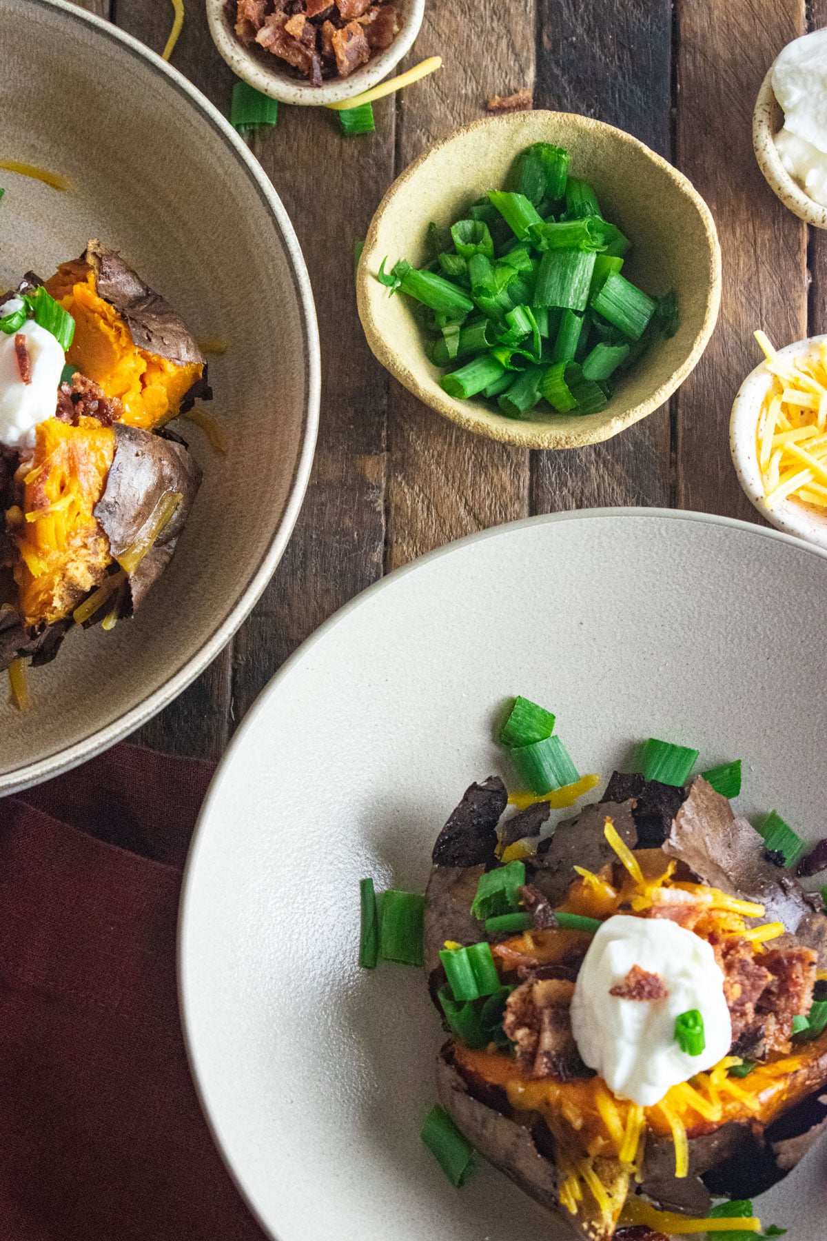 Fully Loaded baked sweet potato filled with cheese, bacon, scallions, and plain Greek yogurt.
