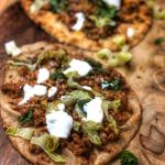 taco naan pizza on a wooden cutting board
