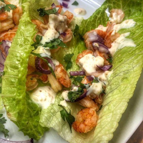 close up of honey adobo shrimp tacos