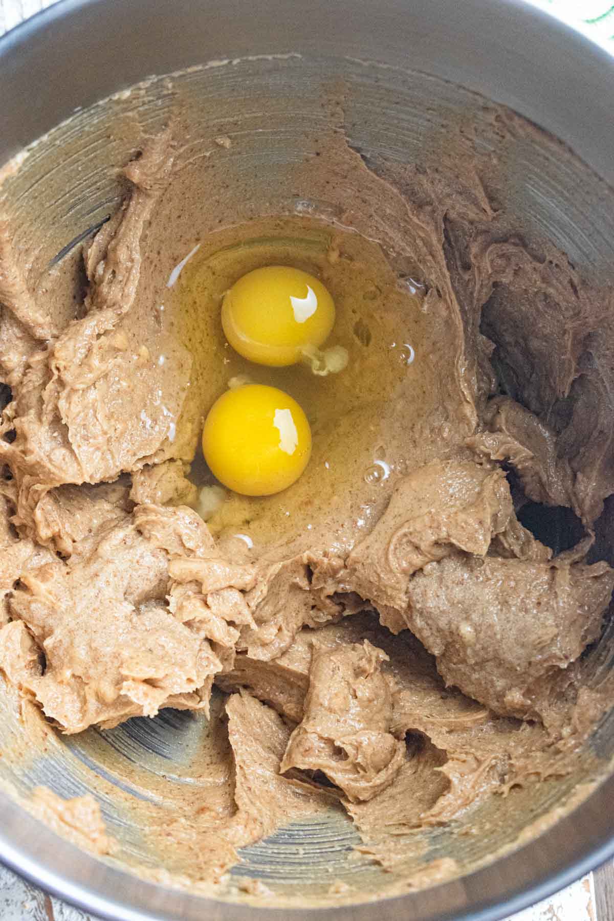 Step 3 - eggs and vanilla extract being added into the cookie mixture. 