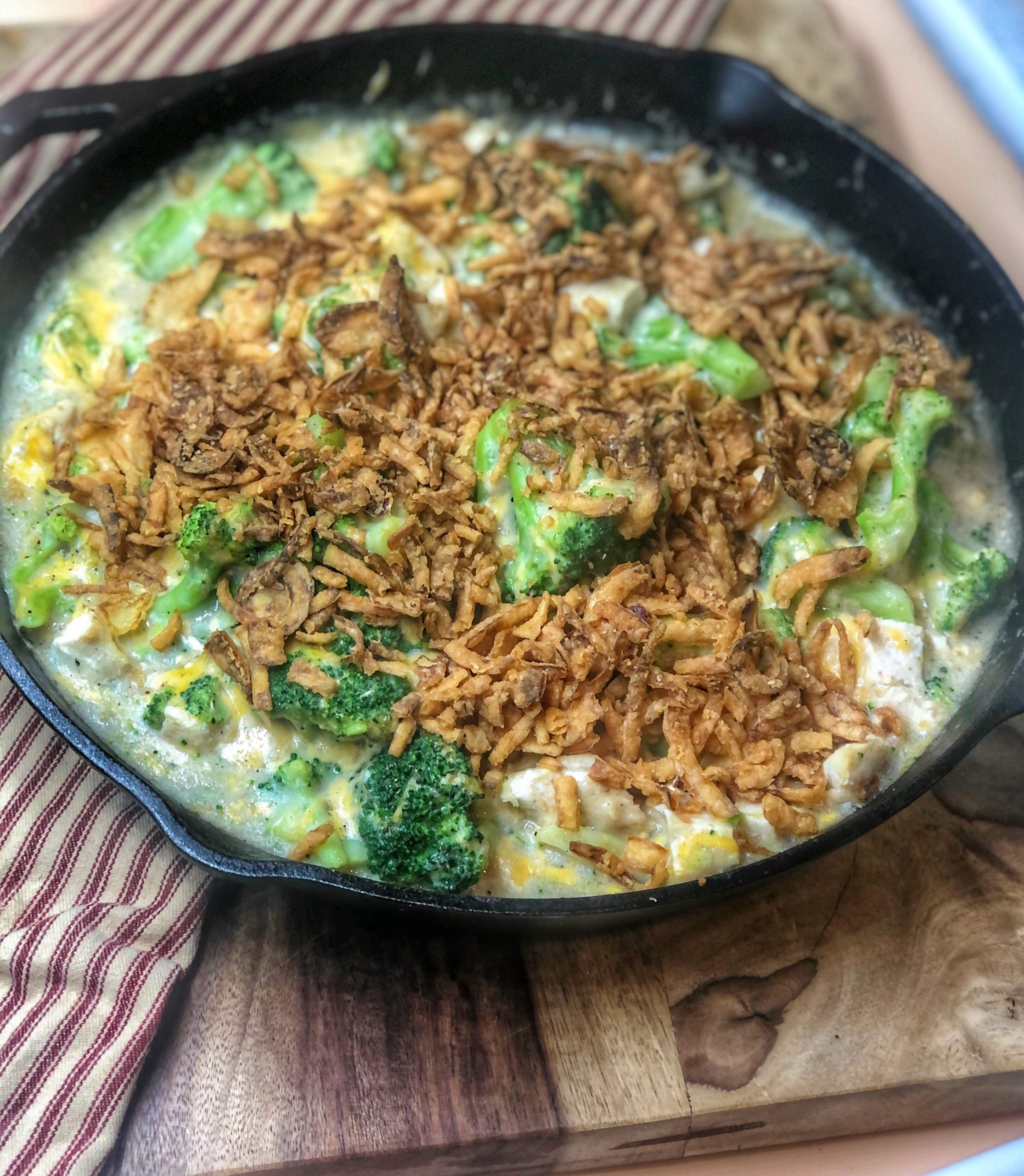 chicken and broccoli casserole in a cast iron skilelt
