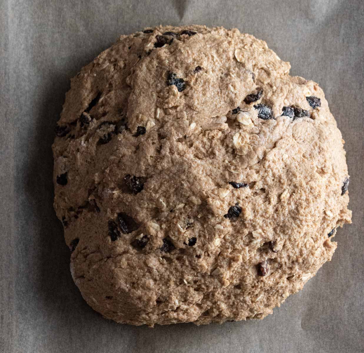 wet dough formed into a loaf all ready to bake