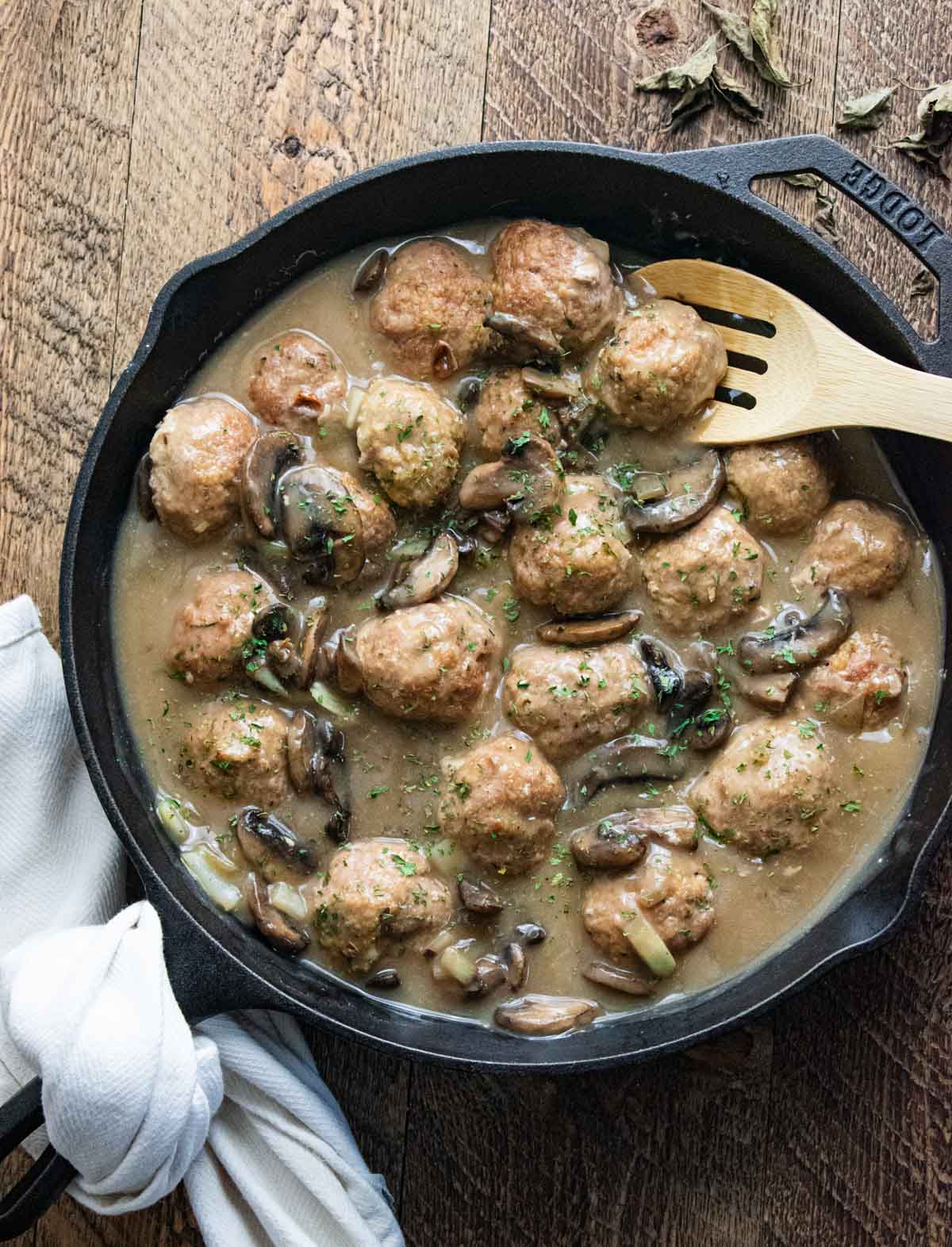 swedish meatball stroganoff with a creamy mushroom sauce being