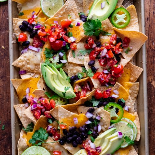 birds eye view of loaded vegetarian sheet pan nachos