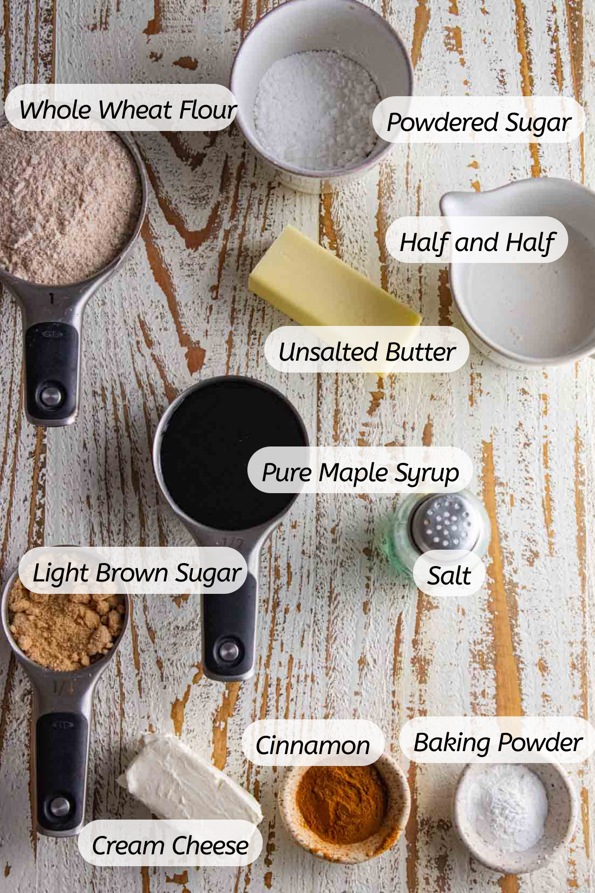 birds-eye view of all ingredients you will need to make these cinnamon buns with labels included. 