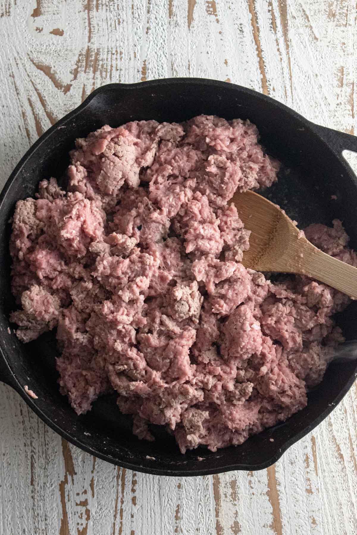 Step 2 - ground turkey being cooked in a Lodge cast-iron skillet