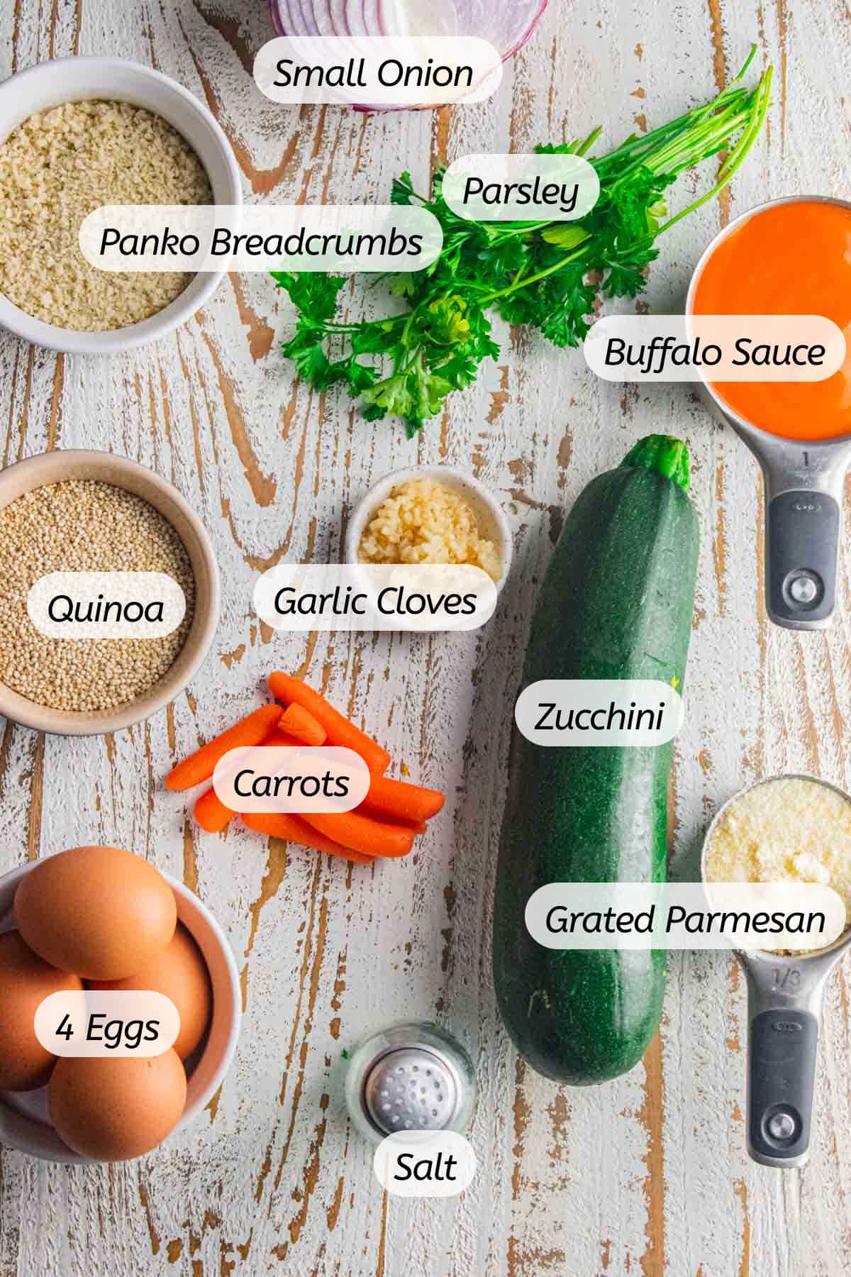 A birds eye view of all the ingredients needed to make buffalo quinoa balls with labels included.