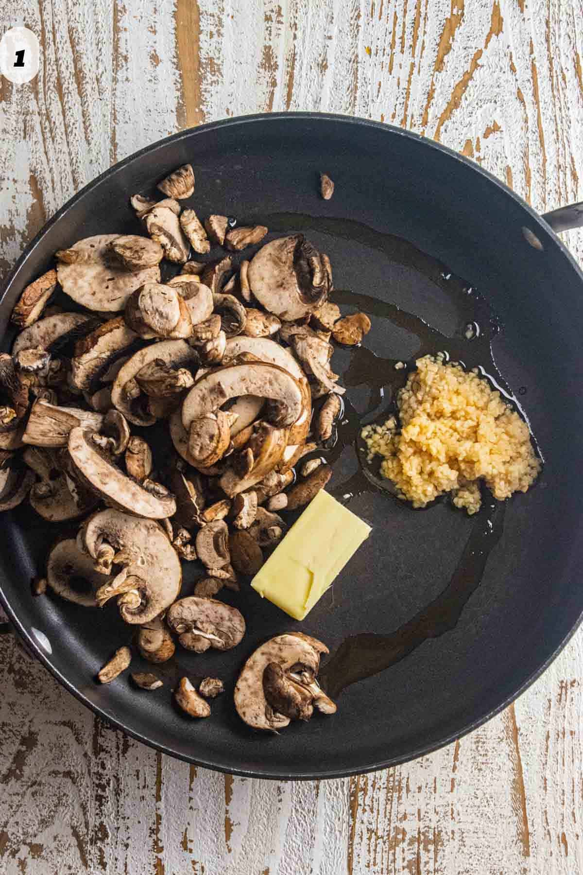 Step 1 - mushrooms, butter, and garlic in a pan with olive oil.