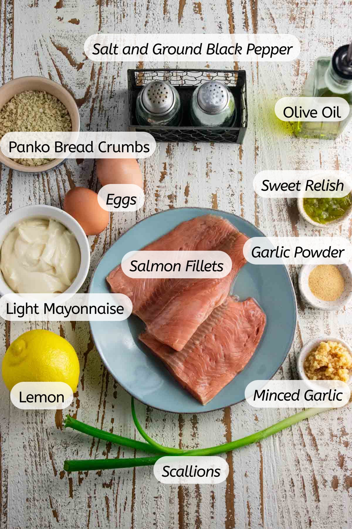 A birds-eye view of all the ingredients needed to make this panko salmon dish with labels included.